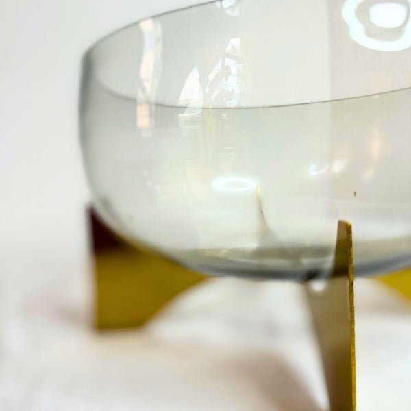 Glass vase on metal stand
