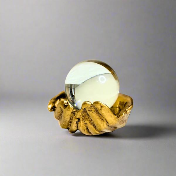 Crystal ball in palm