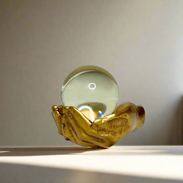 Crystal ball in palm