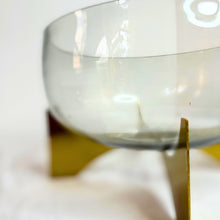 Glass vase on metal stand