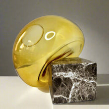 Gold vase on a square stand