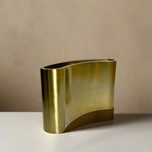 Curved metal vase