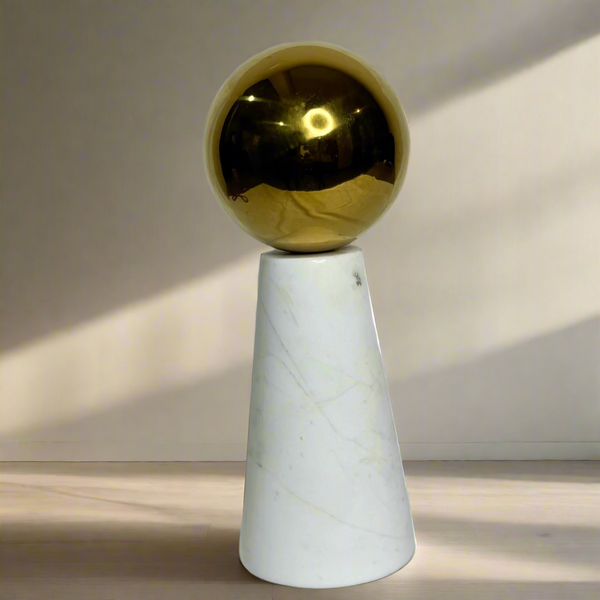 White marble ornament with gold ball