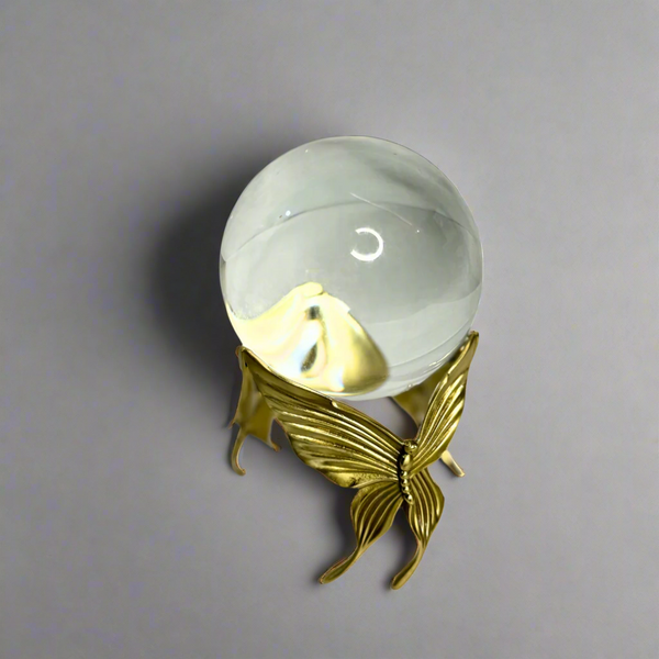 Crystal ball on gold stand