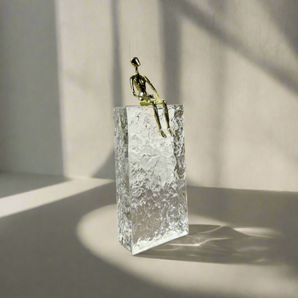 Crystal block with gold sitting man