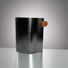 Steel vase with leather tag