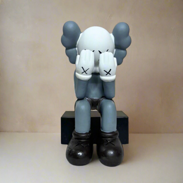 Kaws sitting