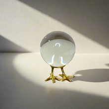 Crystal ball on gold stand