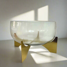 Glass vase on metal stand