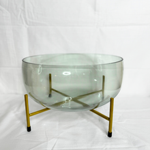 Glass vase on metal stand