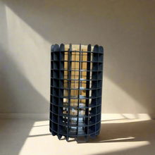 Gold vase in black metal casing
