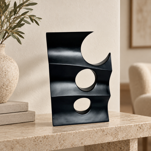 Black decoration piece with holes — lifestyle