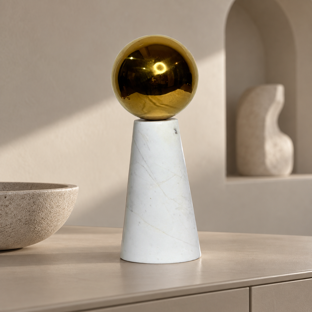 White marble ornament with gold ball — lifestyle